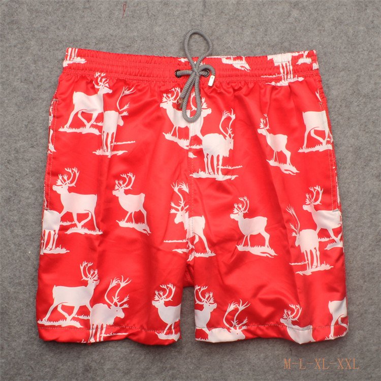 Red reindeer print board shorts