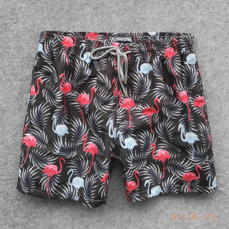 Black flamingo print board shorts