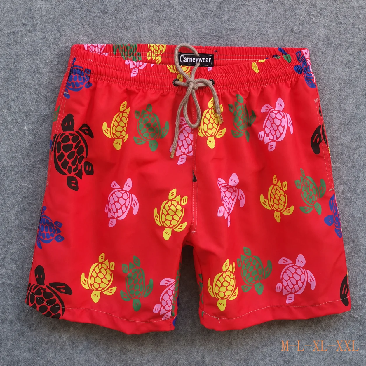 Front view of Red Multicolor Turtle Board Shorts