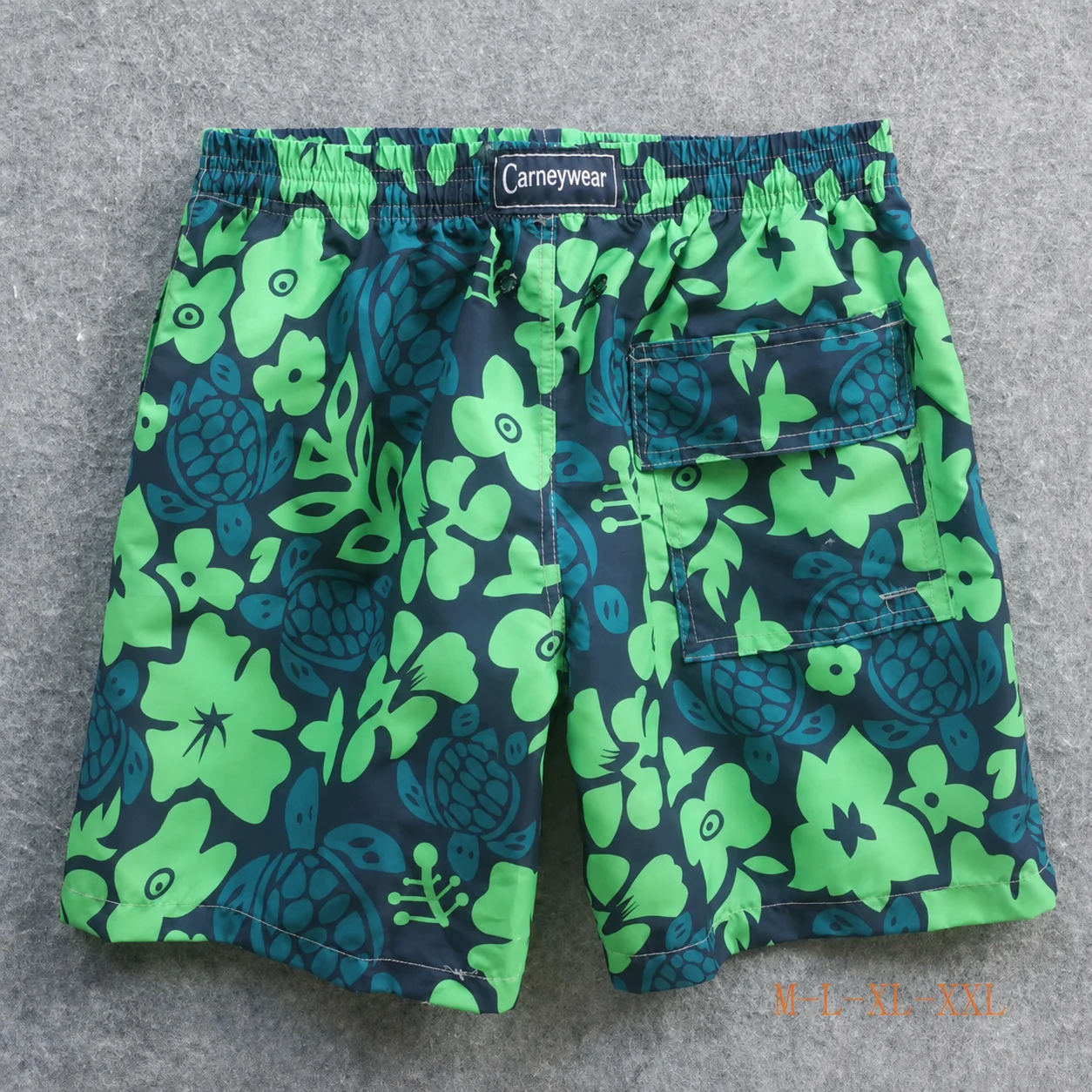 Back view of Black Green Tropical Board Shorts