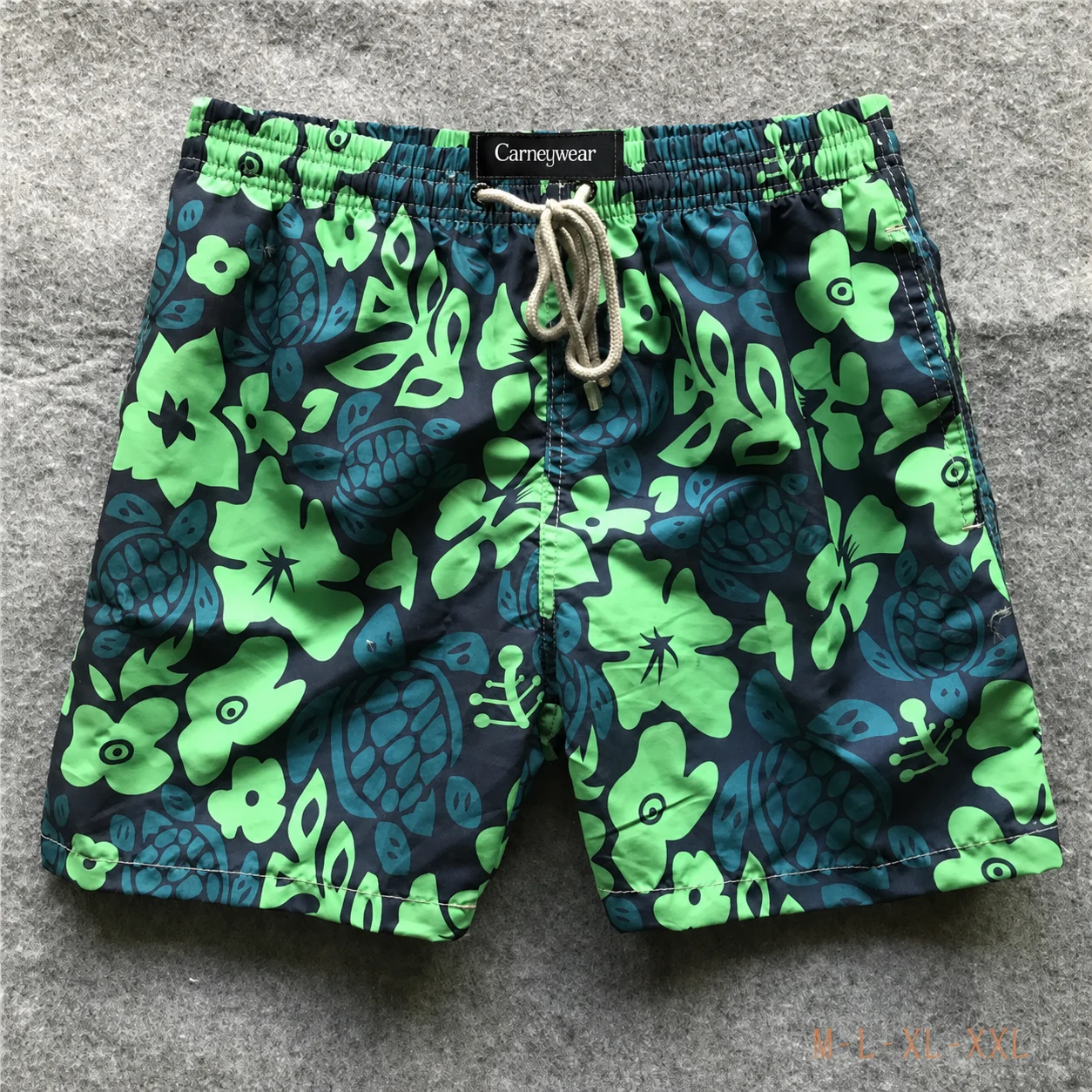 Front view of Black Green Tropical Board Shorts