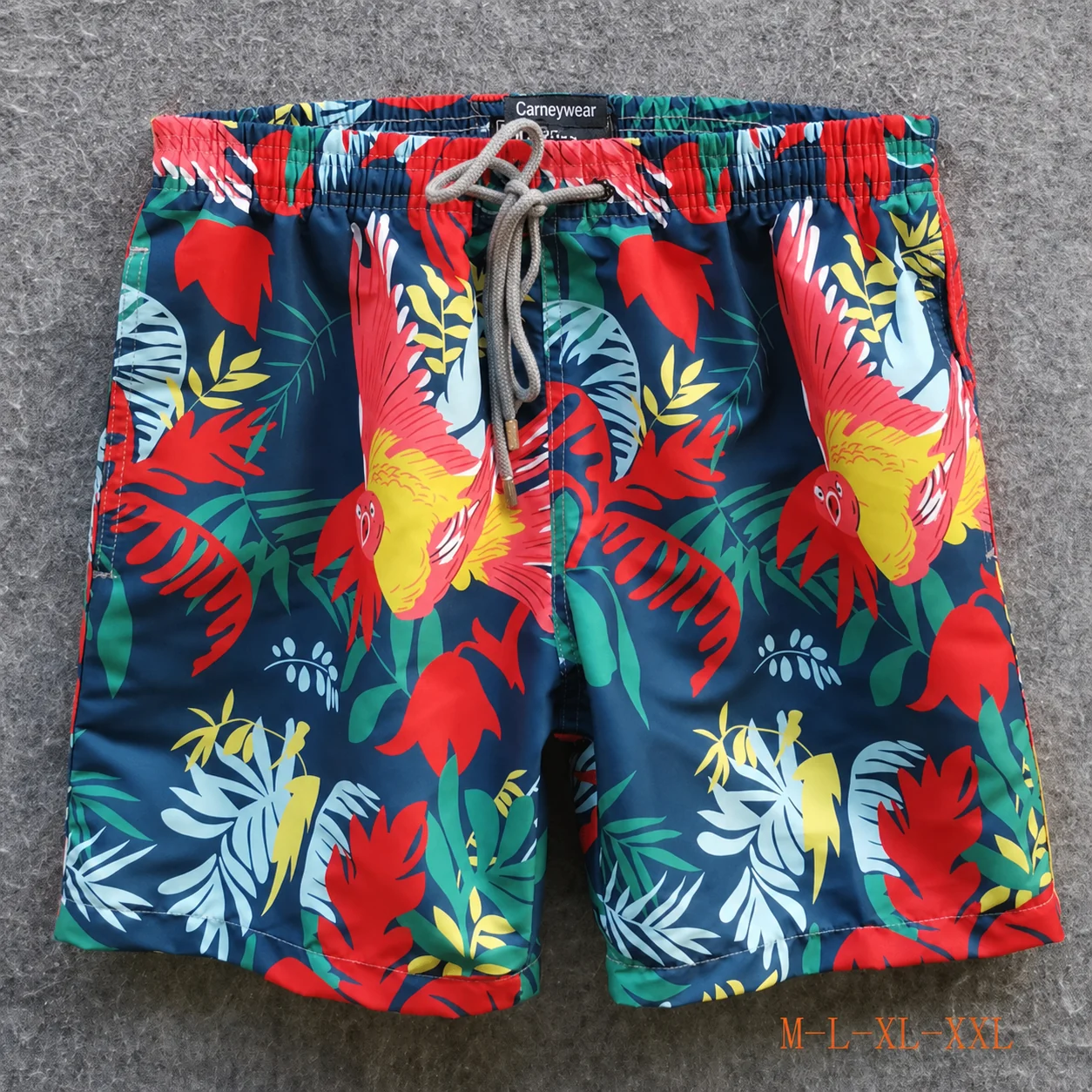 Front view of Dark Teal Parrot Print Board Shorts