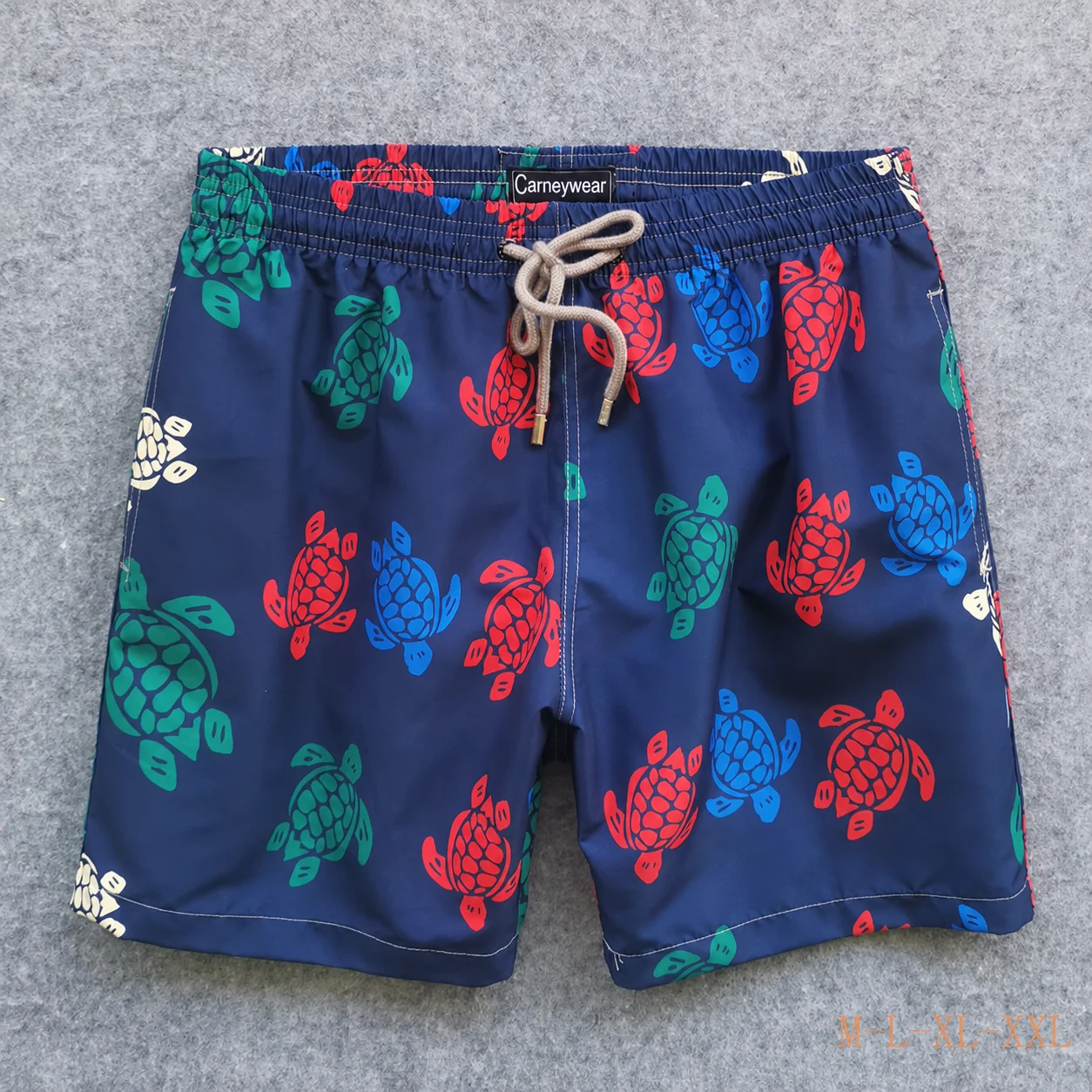 Front view of Navy Multicolor Turtle Board Shorts