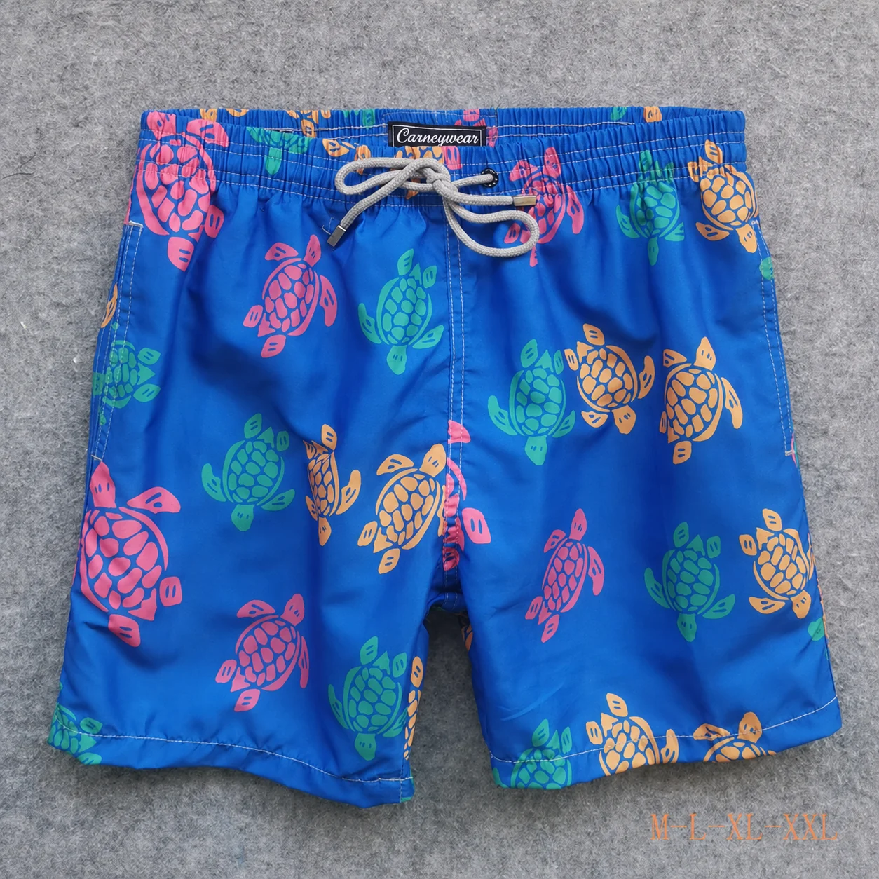 Front view of Royal Blue Turtle Print Board Shorts