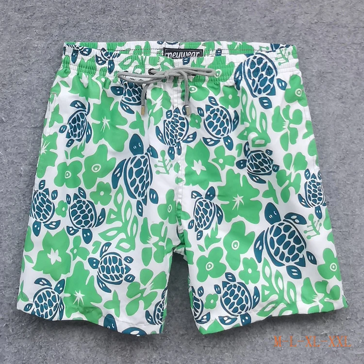 Front view of White Green Turtle Board Shorts